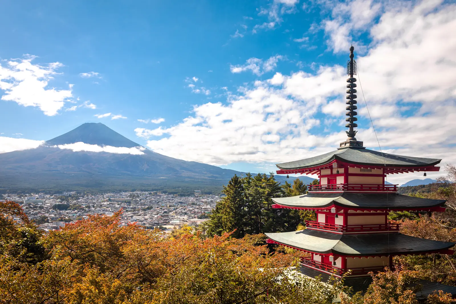The five-storey Chureito Pagoda on the hillside above Fujiyoshida with Mount Fuji behind, October