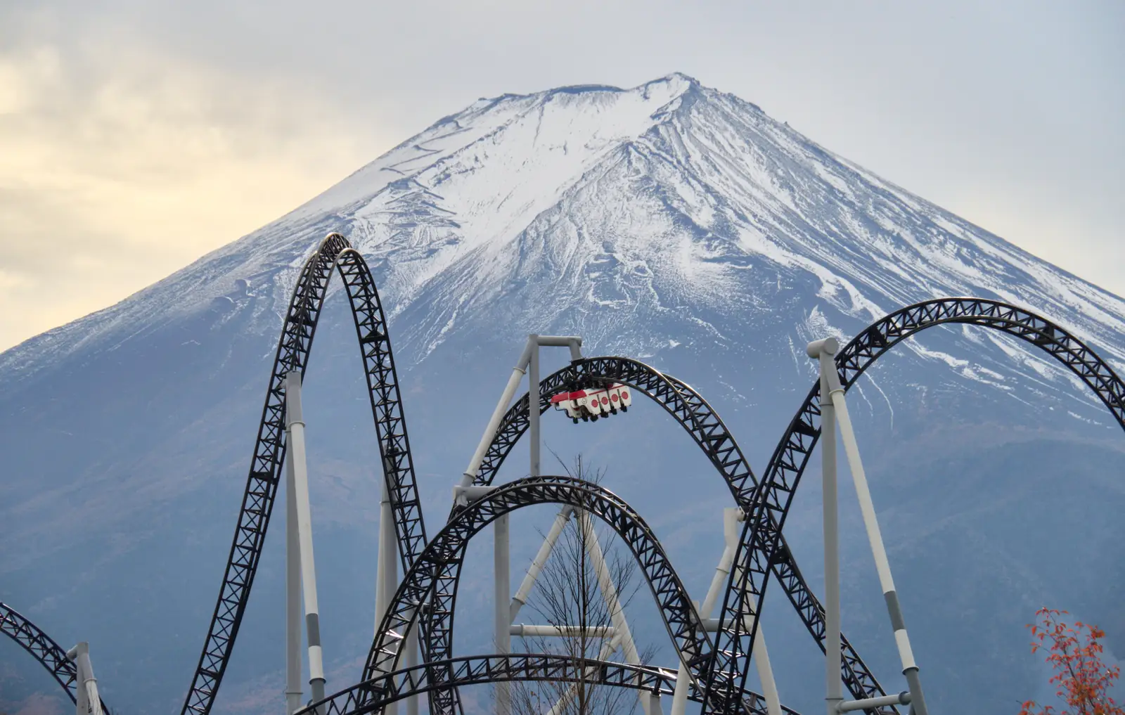 Roller coaster track at Fuji-Q Highland with Mount Fuji behind, November