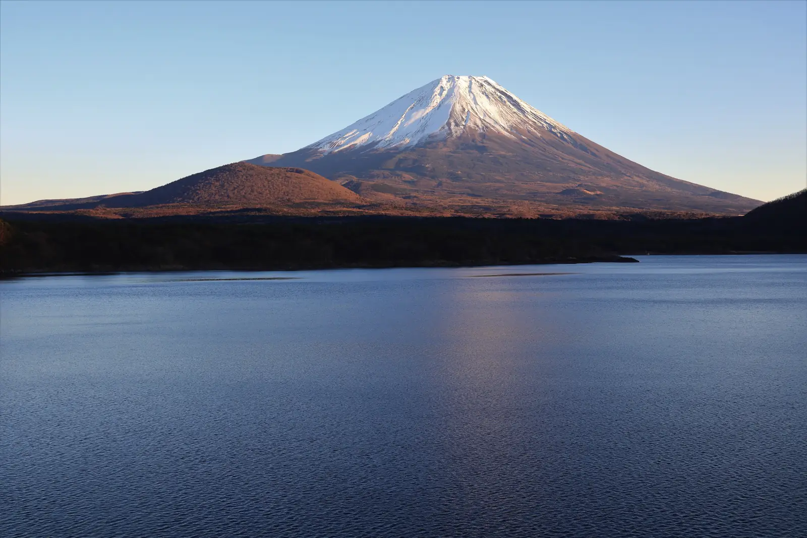 Mt Fuji above Lake Motosu in late-afternoon light, the westernmost of the Fuji Five Lakes
