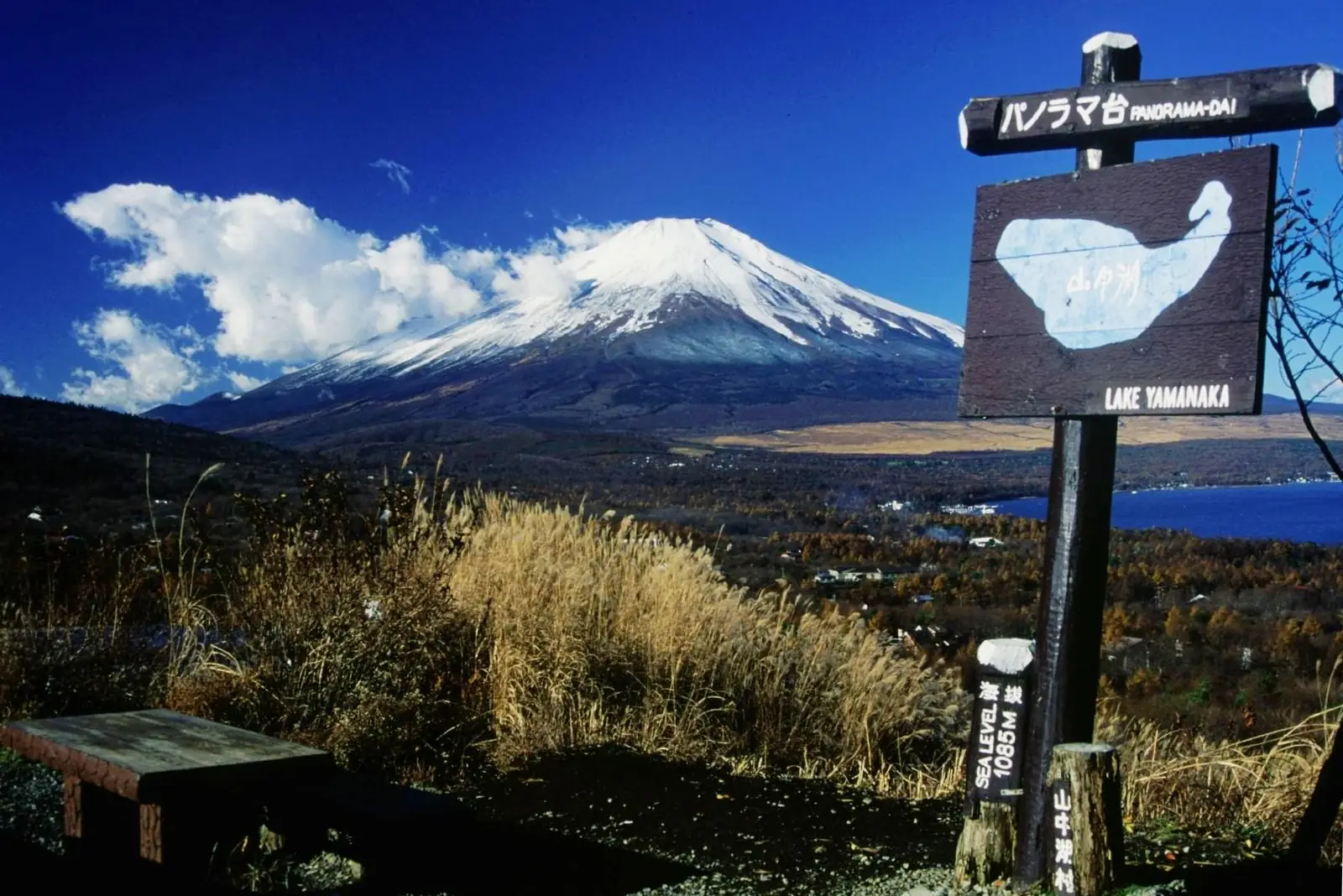 Mt Fuji and Lake Yamanaka seen from the Panorama-dai viewpoint, with the viewpoint signboard on the right
